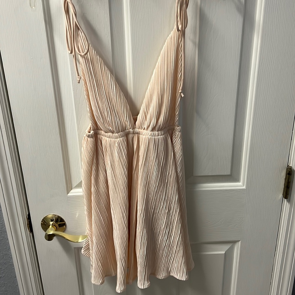 lucy in the sky looks like a dress but is a romper. creamish pink color